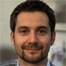 Smiling bearded man in suit — Aipick Zone